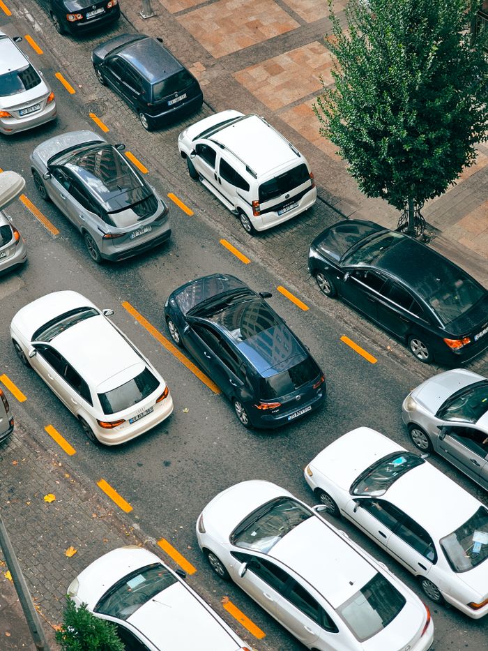 Top view of cars stuck in heavy traffic on a city street.